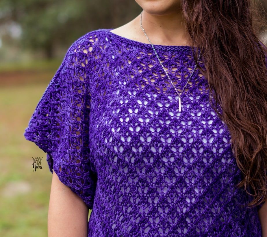 closeup of ultraviolet tee knitting pattern, showing lace knit wide sleeve and shoulder