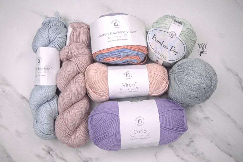 7 colors of universal yarn with white marble background
