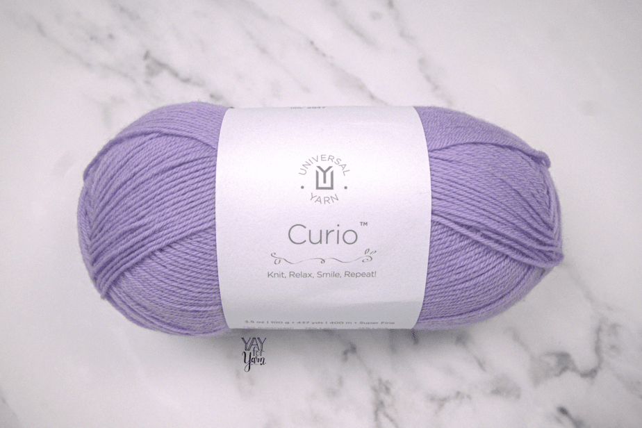 lavender uni merino - curio yarn with white marble background