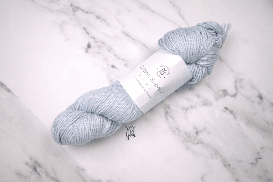 light blue cotton supreme yarn with white marble background